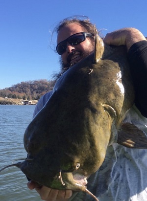 spencer hardin holding big flathead catfish